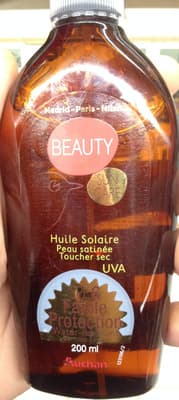 Huile solaire peau satinée toucher sec